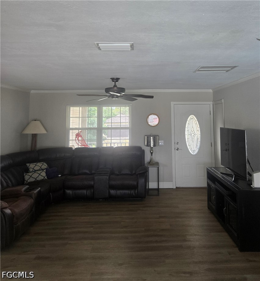 8093 Anhinga Road Fort Myers, FL 33967 - Photo 16 of 49 a living room with furniture a window and a flat screen tv