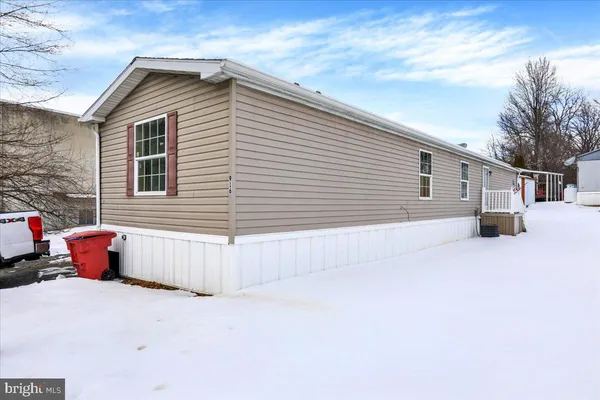 a front view of a house with a garage