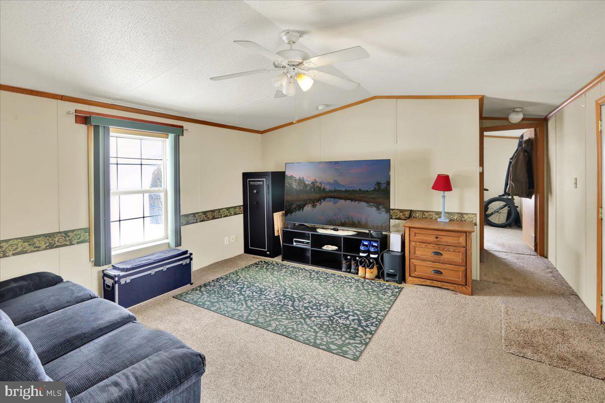 125 Tuckerton Road, Unit 916 Reading, PA 19605 - Photo 6 of 19 a living room with furniture and a flat screen tv