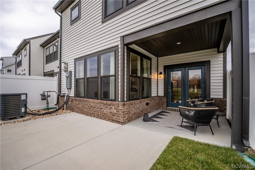 12831 Deep Wl Road Midlothian, VA 23112 - Photo 25 of 50 a building outdoor space with patio furniture and potted plants
