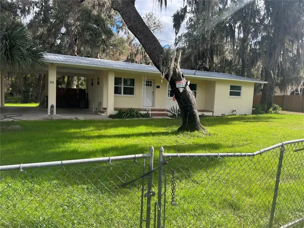 a view of a house with a swimming pool