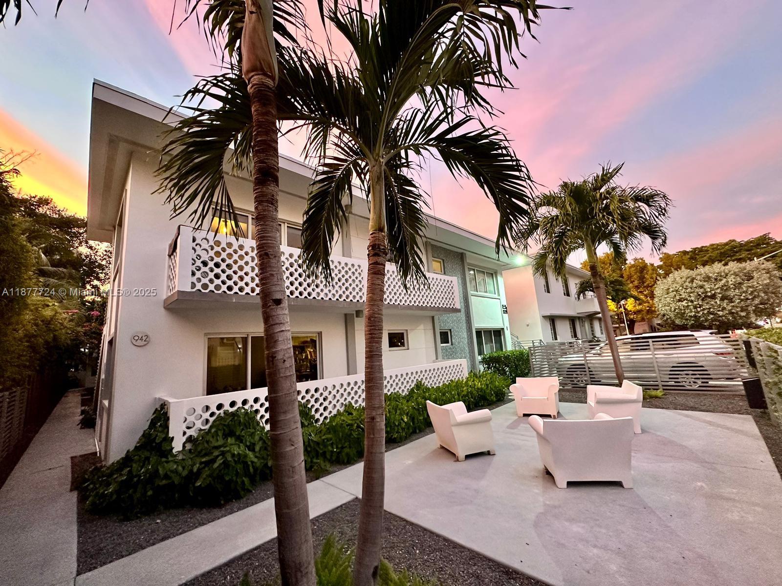 1100 10th Street, Unit 7 Miami Beach, FL 33139 - Photo 3 of 6 front view of a house with a palm tree