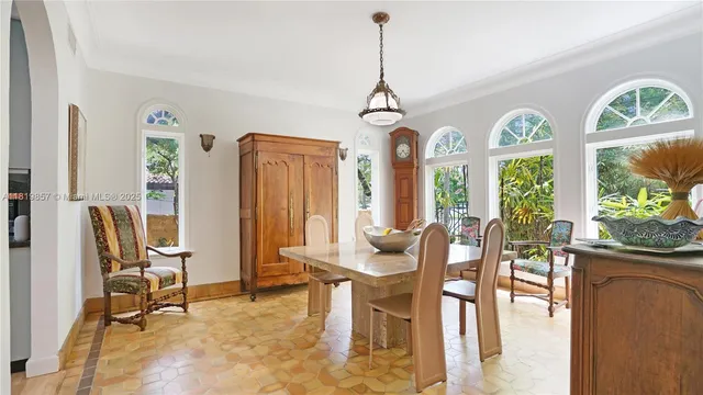 a front view of a house with outdoor seating