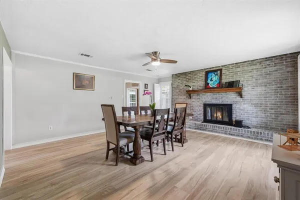 a view of a dining room with furniture and window