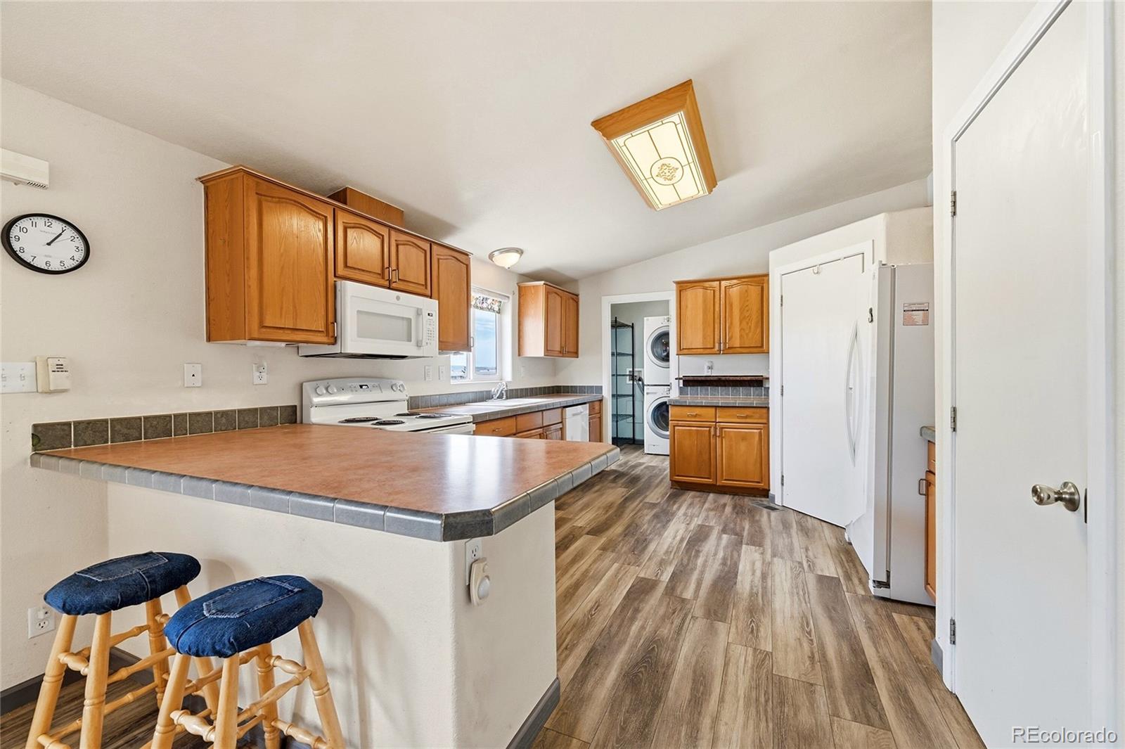 20300 Old Ranch Loop Nathrop, CO 81236 - Photo 5 of 35 a kitchen with stainless steel appliances granite countertop a sink stove and refrigerator