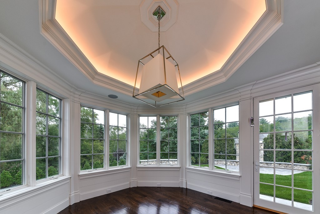 19 Falmouth Road Wellesley, MA 02481 - Photo 11 of 29 a room with large windows and furniture