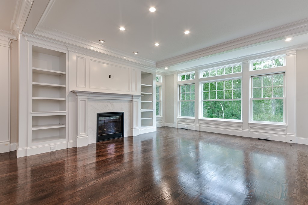 19 Falmouth Road Wellesley, MA 02481 - Photo 12 of 29 a view of an empty room with wooden floor fireplace and a window