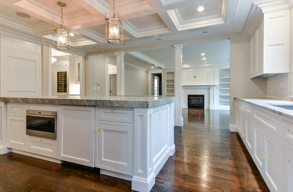 19 Falmouth Road Wellesley, MA 02481 - Photo 7 of 29 a large white kitchen with cabinets a sink and dishwasher