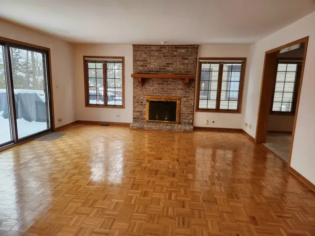a kitchen with kitchen island a stove a refrigerator and a sink
