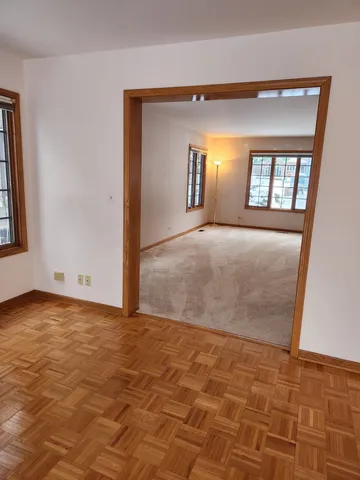 a view of a yard covered in snow