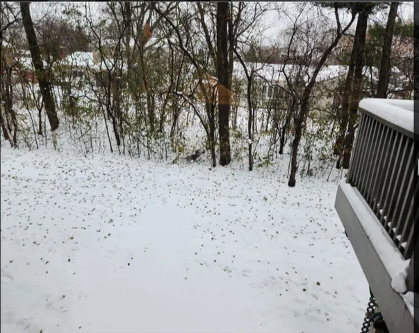 an empty room with sliding door and wooden door