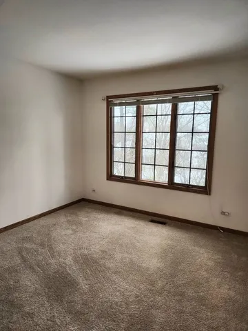 a view of water heater room with window