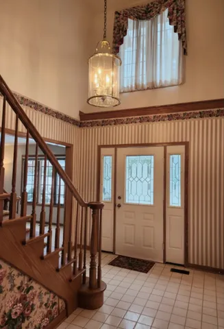 a view of an entryway with wooden floor