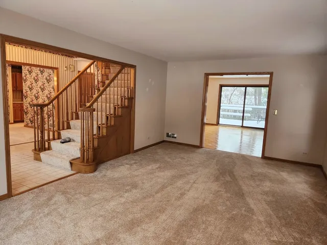 an empty room with large windows