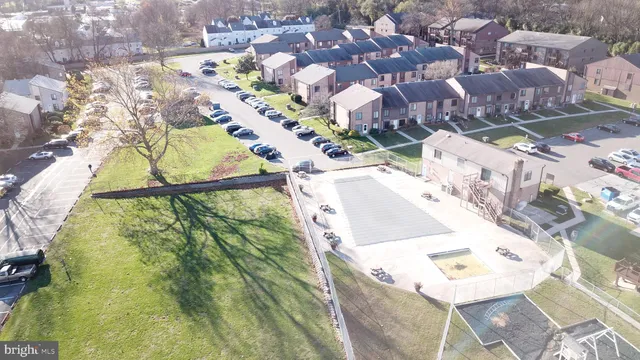 an aerial view of residential houses with yard