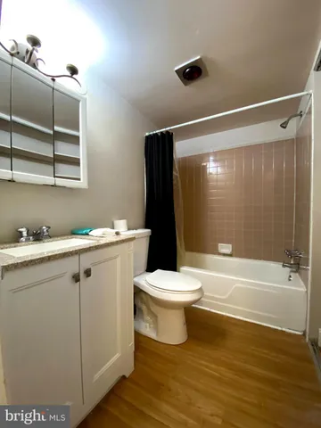 a bathroom with a toilet sink and shower