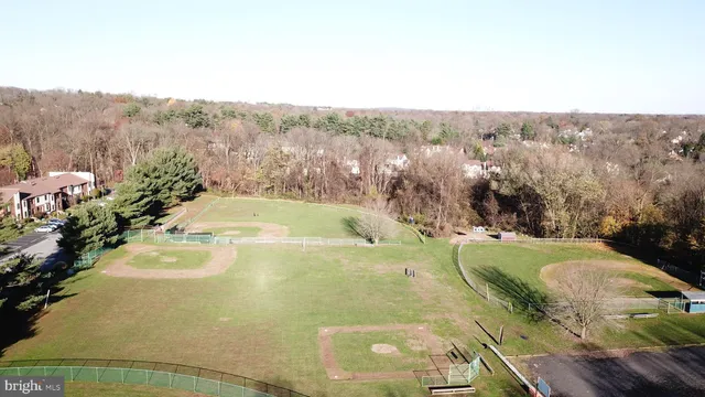 a view of a swimming pool with a yard