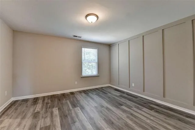 a view of room with window and hardwood floor