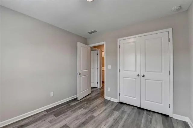 a view of an empty room and wooden floor