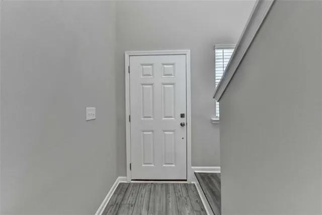 wooden floor and window in an empty room
