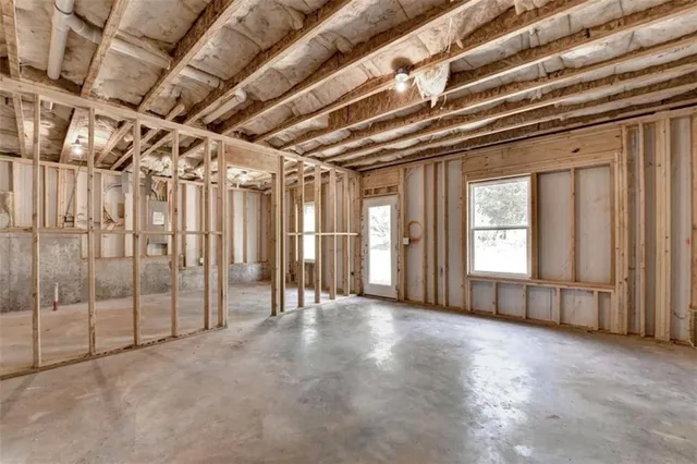 a view of empty room with wooden walls
