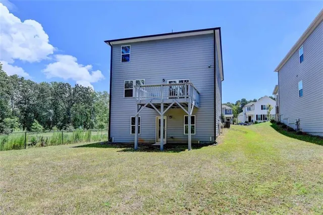 a view of a back yard of the house