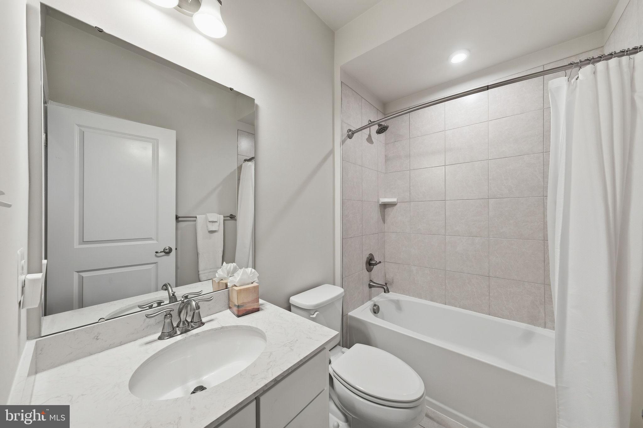 3012 Bretons Ridge Way Hanover, MD 21076 - Photo 28 of 37 a bathroom with a sink a toilet and a bathtub