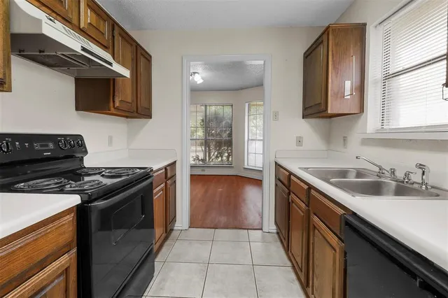 a kitchen with a stove and a sink