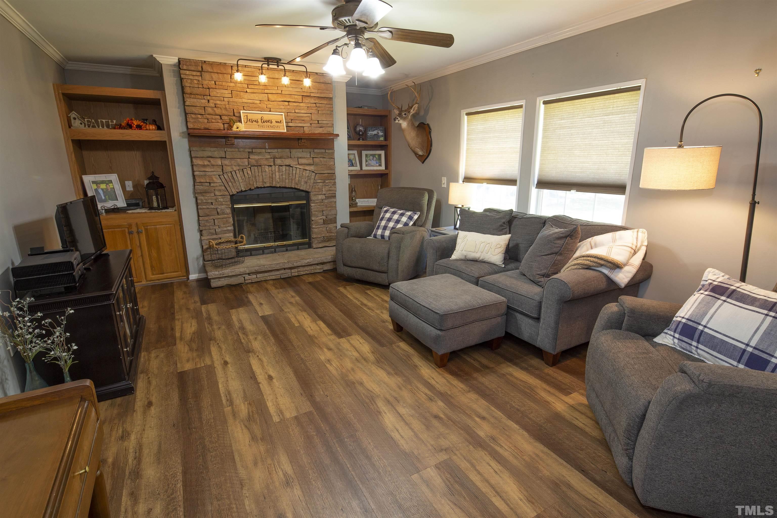 510 Vick Road Spring Hope, NC 27882 - Photo 14 of 29 a living room with furniture and a fireplace