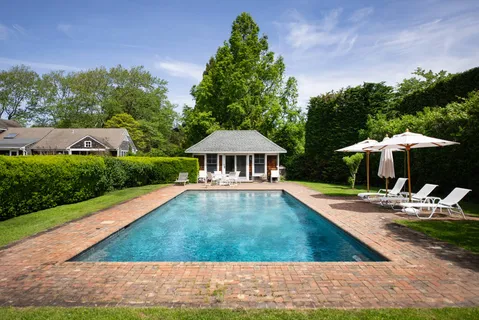a view of a house with backyard space and balcony