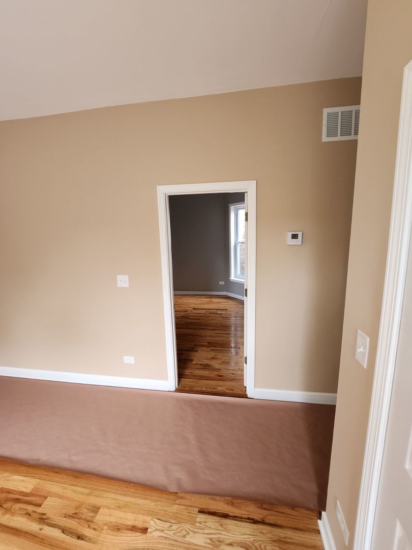 Undisclosed Address Chicago, IL 60624 - Photo 18 of 27 a view of walk in closet