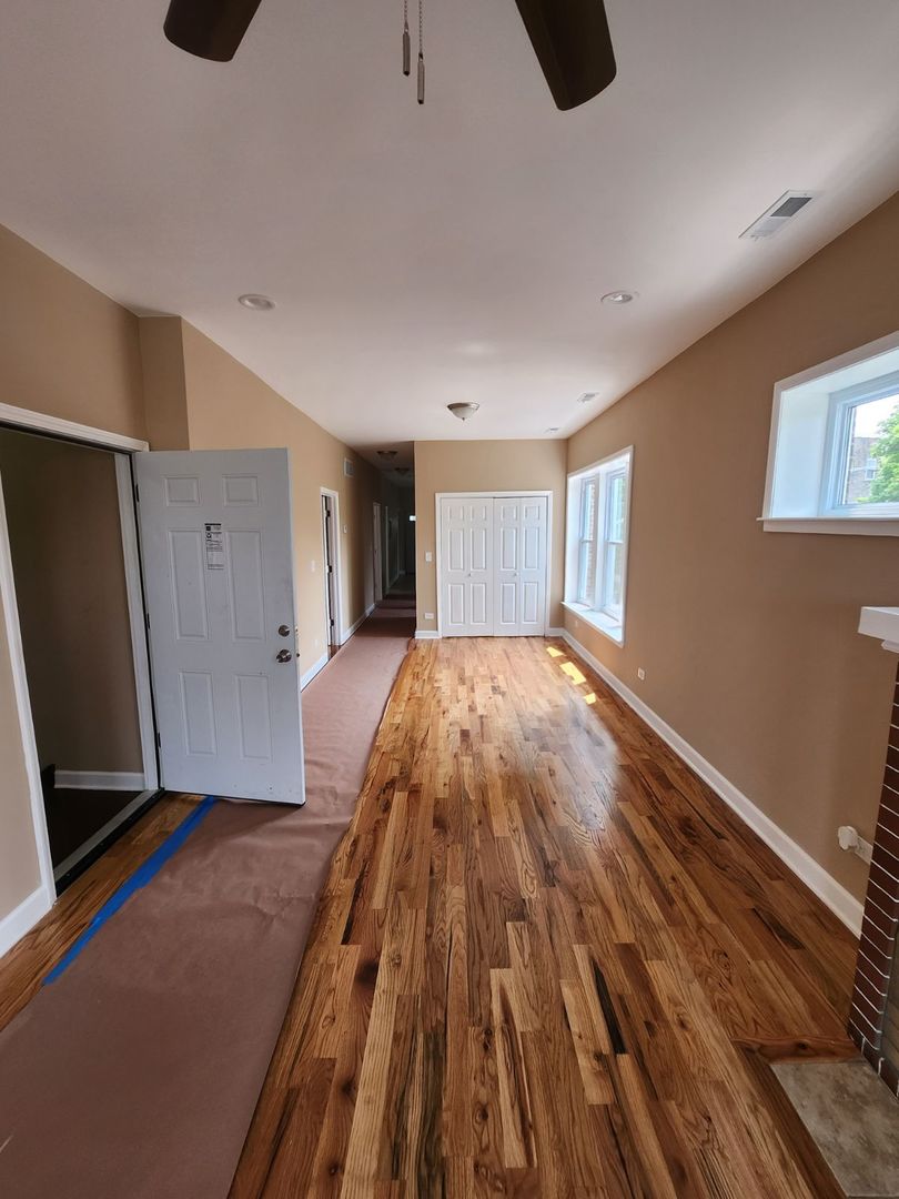 Undisclosed Address Chicago, IL 60624 - Photo 20 of 27 a view of an empty room with wooden floor