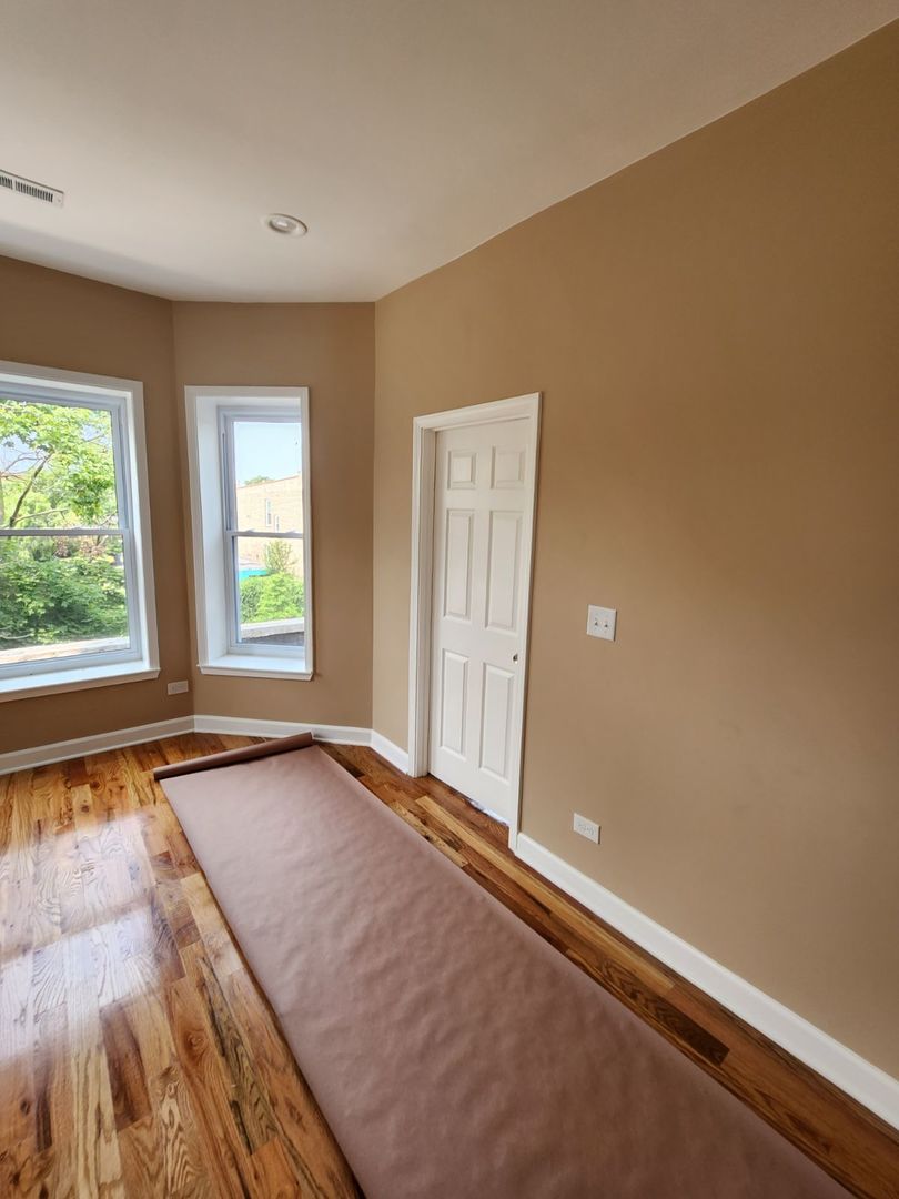 Undisclosed Address Chicago, IL 60624 - Photo 23 of 27 a view of an empty room and window