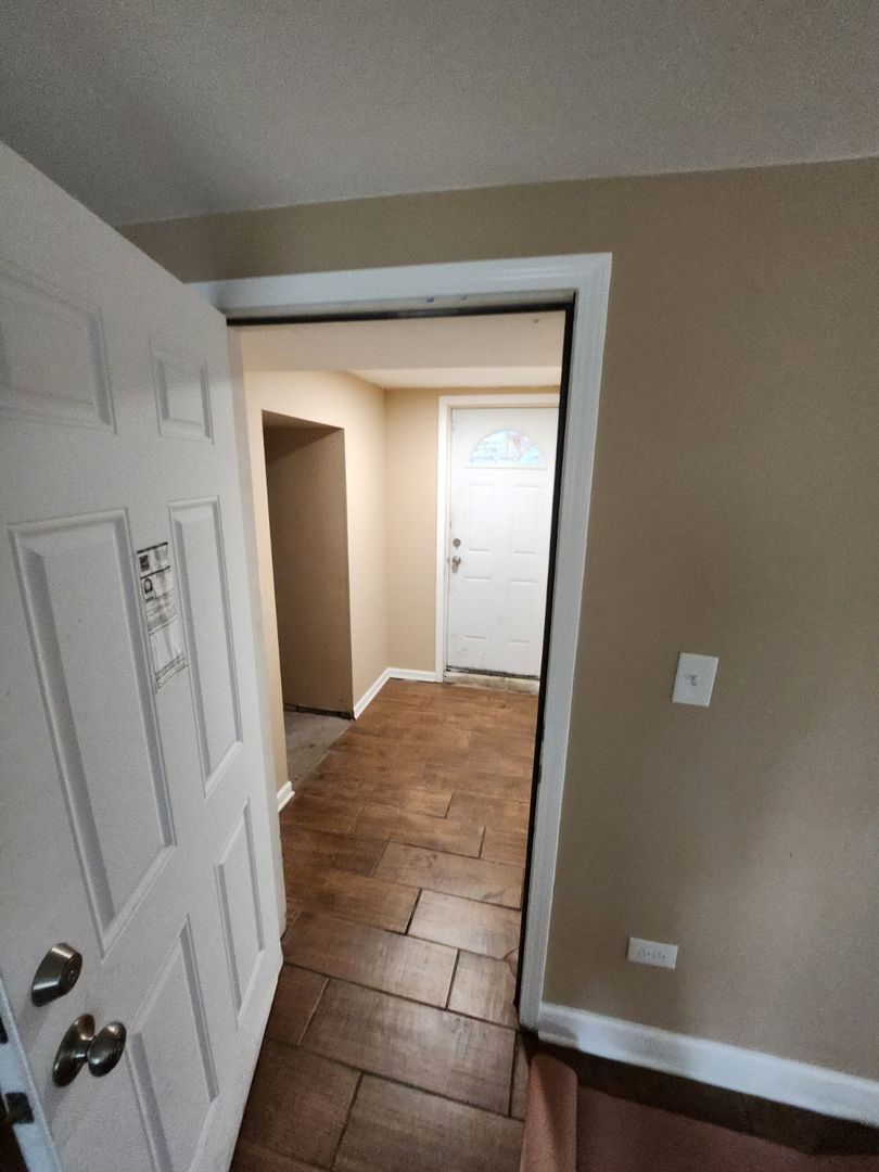 Undisclosed Address Chicago, IL 60624 - Photo 5 of 27 a view of livingroom with hardwood floor