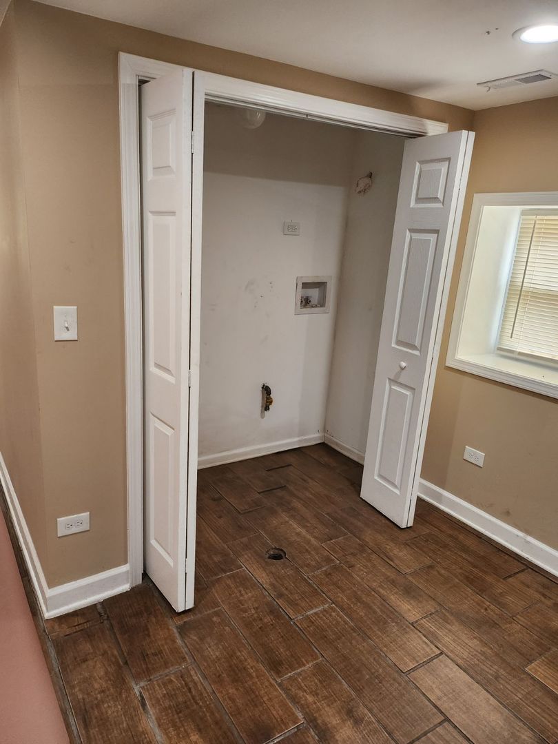 Undisclosed Address Chicago, IL 60624 - Photo 8 of 27 an empty room with windows and closet