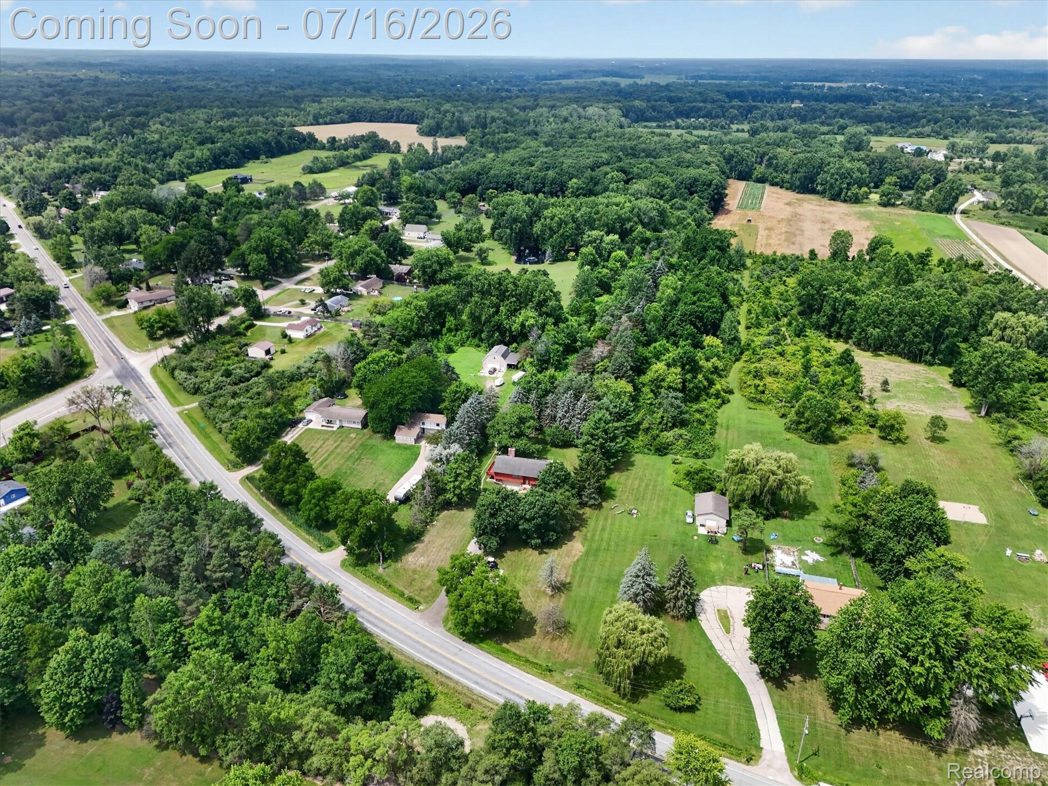 11210 Linden Road Linden, MI 48451 - Photo 52 of 61 Aerial perspective showcasing a verdant landscape with scattered residential properties