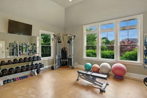 a work room with furniture and a chandelier