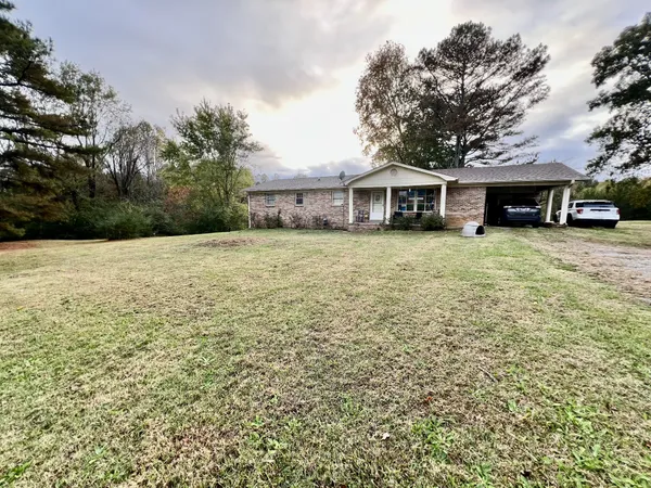 a front view of a house with yard