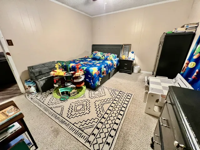 a bedroom with bed and a window