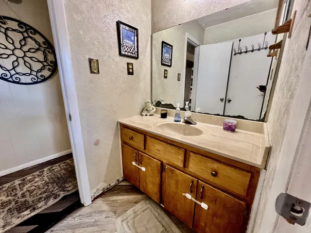 a bathroom with a sink double vanity and a mirror