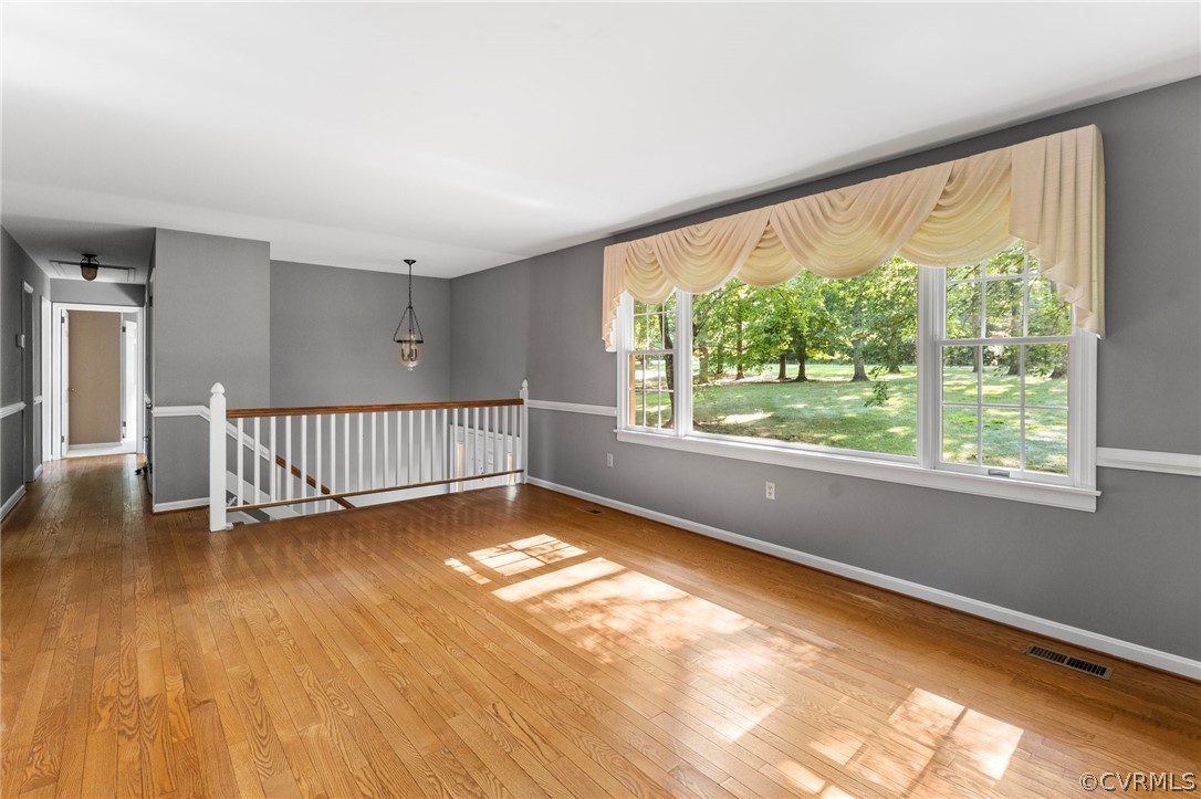 653 Purkins Road Tappahannock, VA 22560 - Photo 11 of 34 Empty room featuring hardwood / wood-style floors