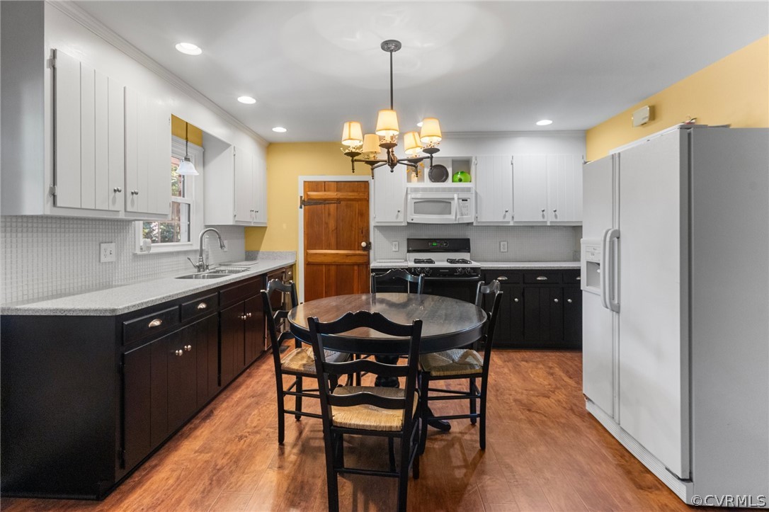 653 Purkins Road Tappahannock, VA 22560 - Photo 14 of 34 Kitchen with white appliances, sink, pendant light