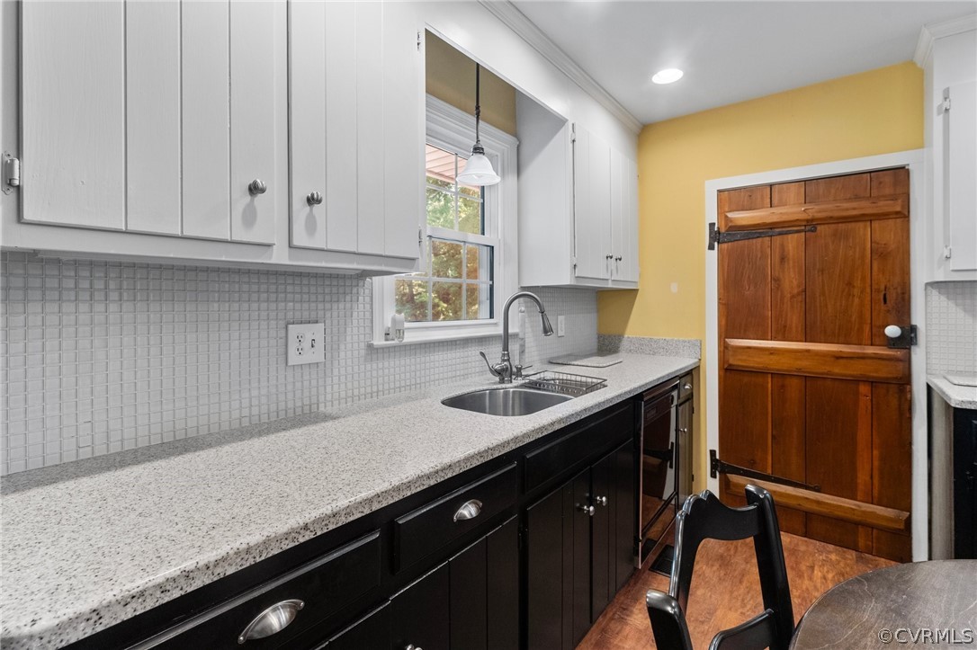 653 Purkins Road Tappahannock, VA 22560 - Photo 15 of 34 Kitchen featuring sink, pendant lighting, backspla
