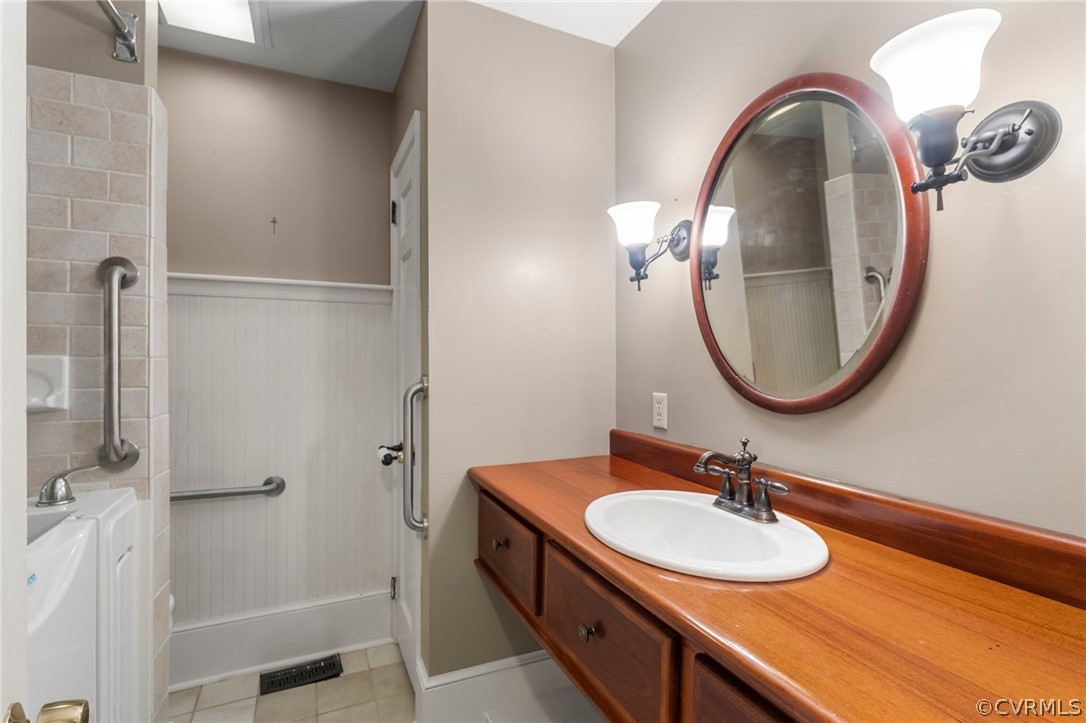 653 Purkins Road Tappahannock, VA 22560 - Photo 25 of 34 Bathroom featuring tile patterned flooring and van