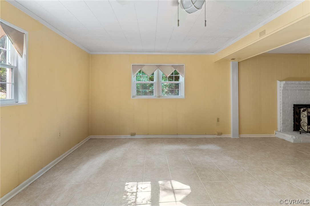 653 Purkins Road Tappahannock, VA 22560 - Photo 27 of 34 Unfurnished living room featuring a fireplace, lig