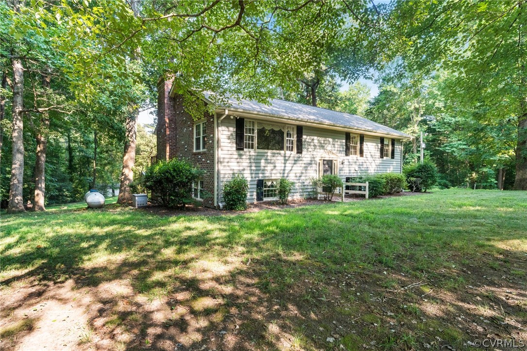 653 Purkins Road Tappahannock, VA 22560 - Photo 3 of 34 View of front of property featuring a front yard