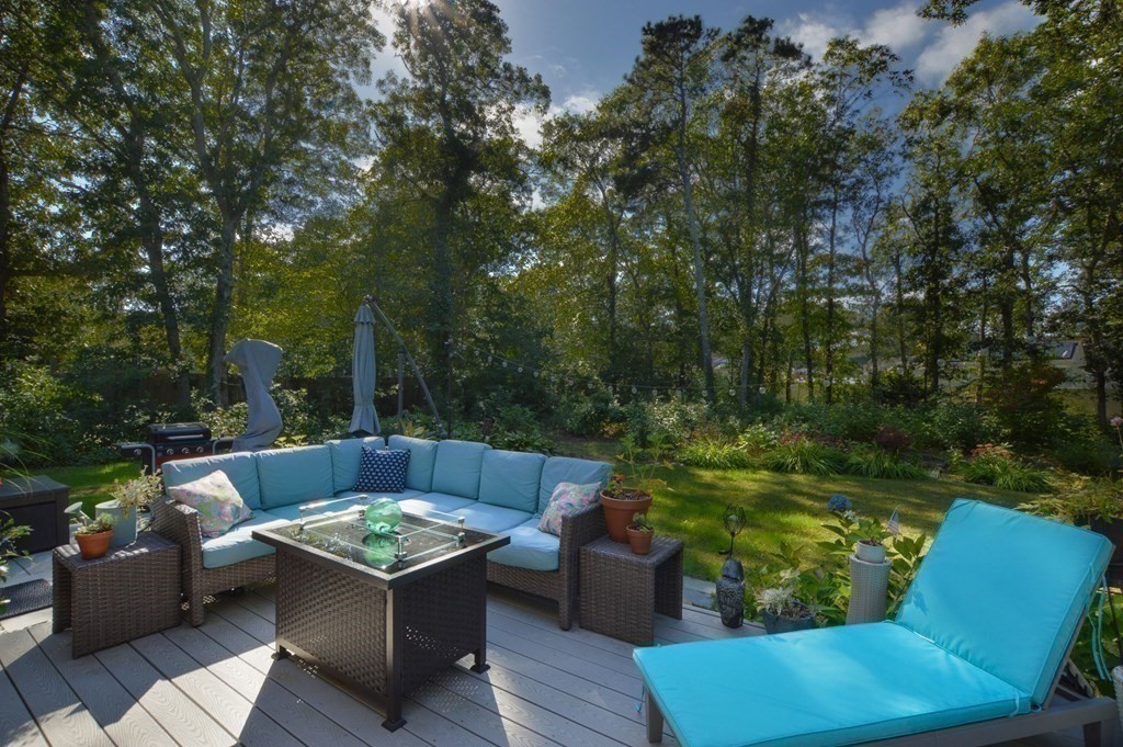 829 Pitchers Way Barnstable, MA 02601 - Photo 1 of 32 a view of a chair and fire pit in the backyard