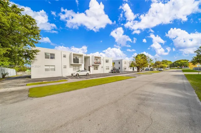 a view of house with outdoor space and swimming pool