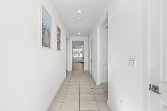 a view of a hallway with a white walls