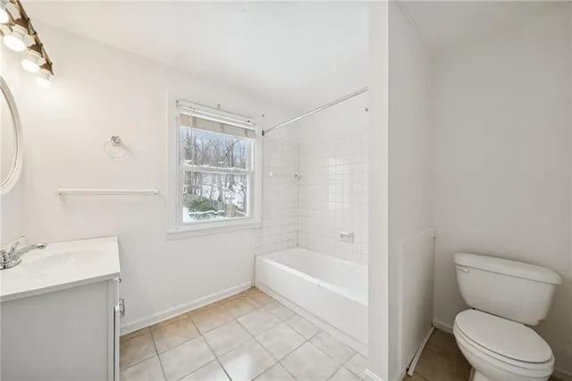 a bathroom with a toilet sink and bathtub